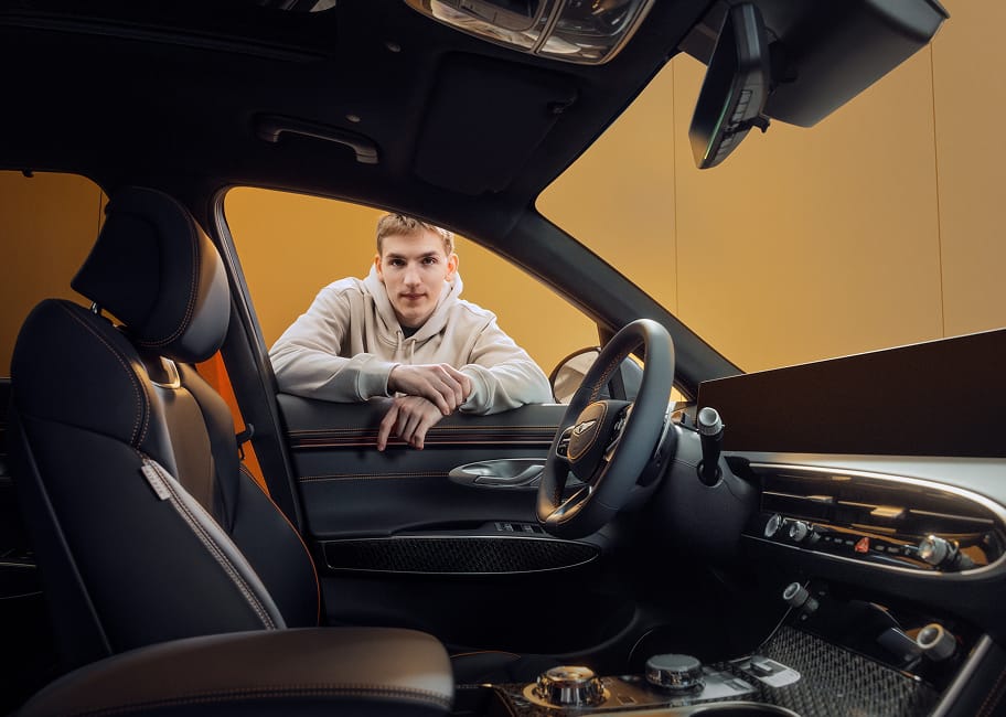 Lane Hutson inside the Genesis GV70