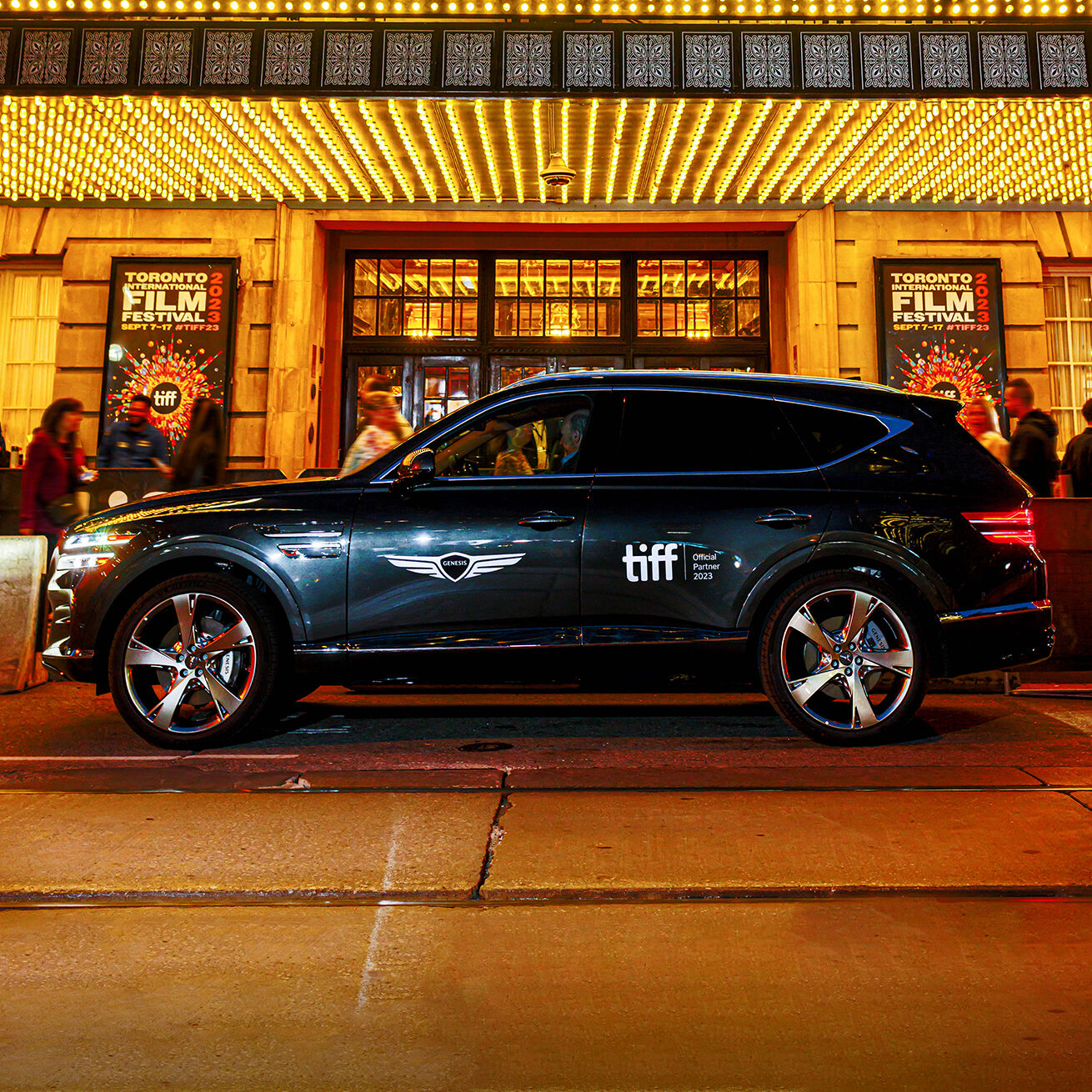 Genesis GV80 parked in front of theatre 