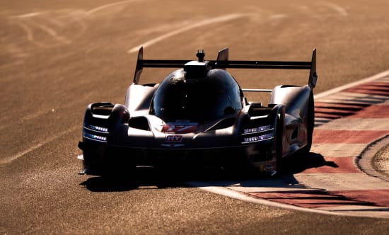 Front view image of the GMR-001 hypercar cornering on a circuit