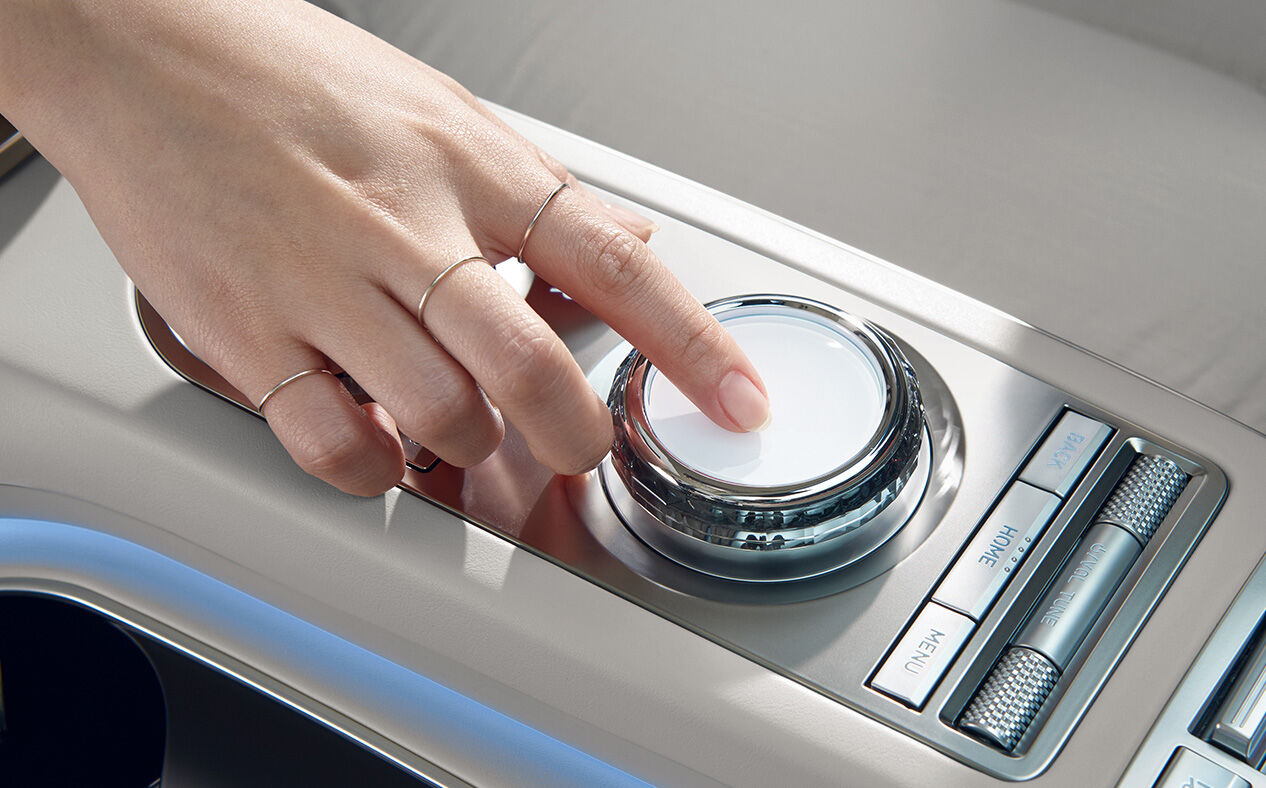 A close-up of a hand controlling the Genesis Integrated Controller.