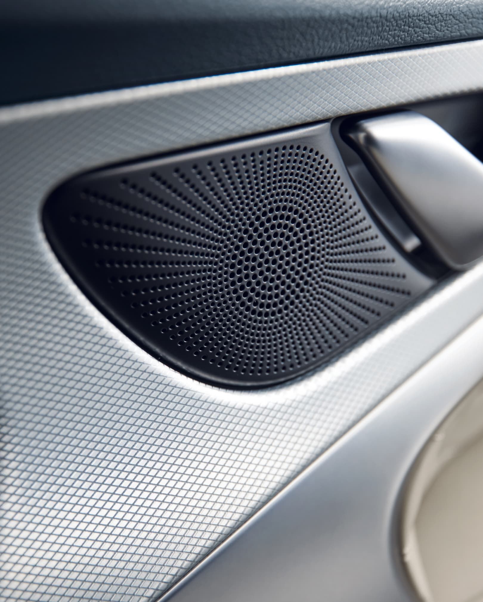 close-up of Genesis G70 speaker with aluminum accents around