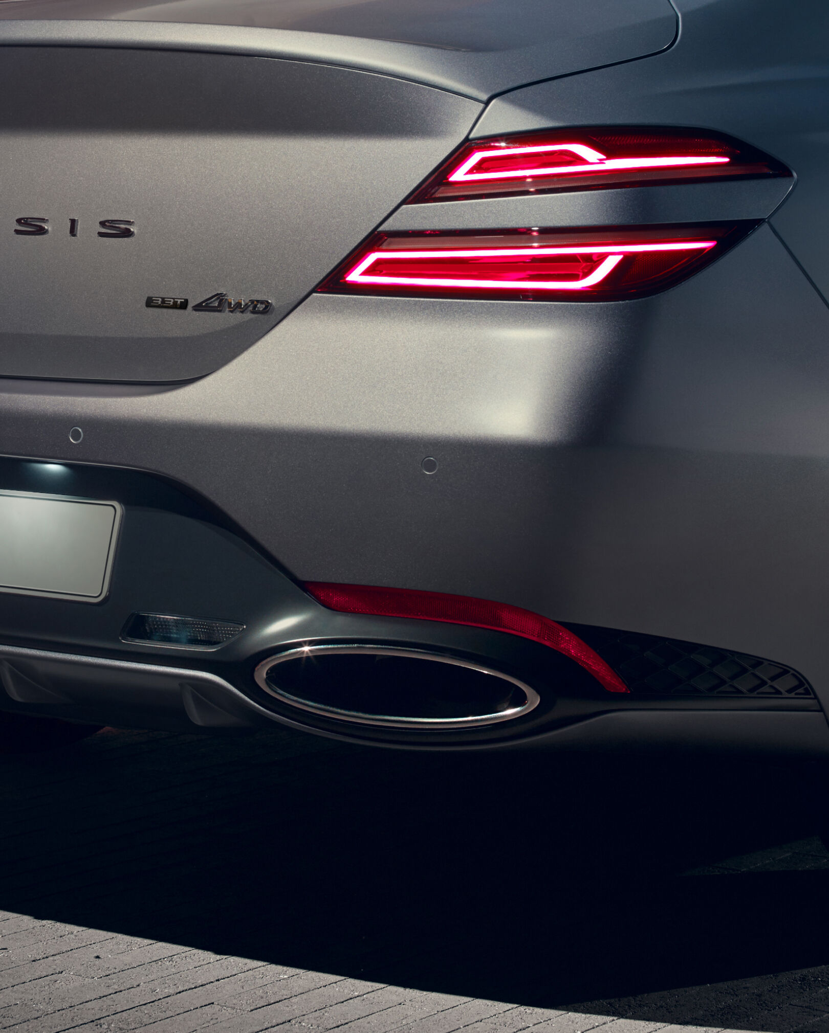  Close-up of the Genesis G70 rear variable exhaust tips