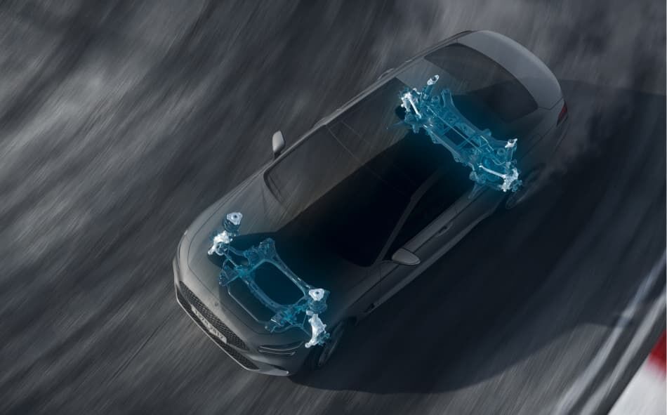 G70 taking a turn on a race track with the electronically controlled suspension highlighted in blue