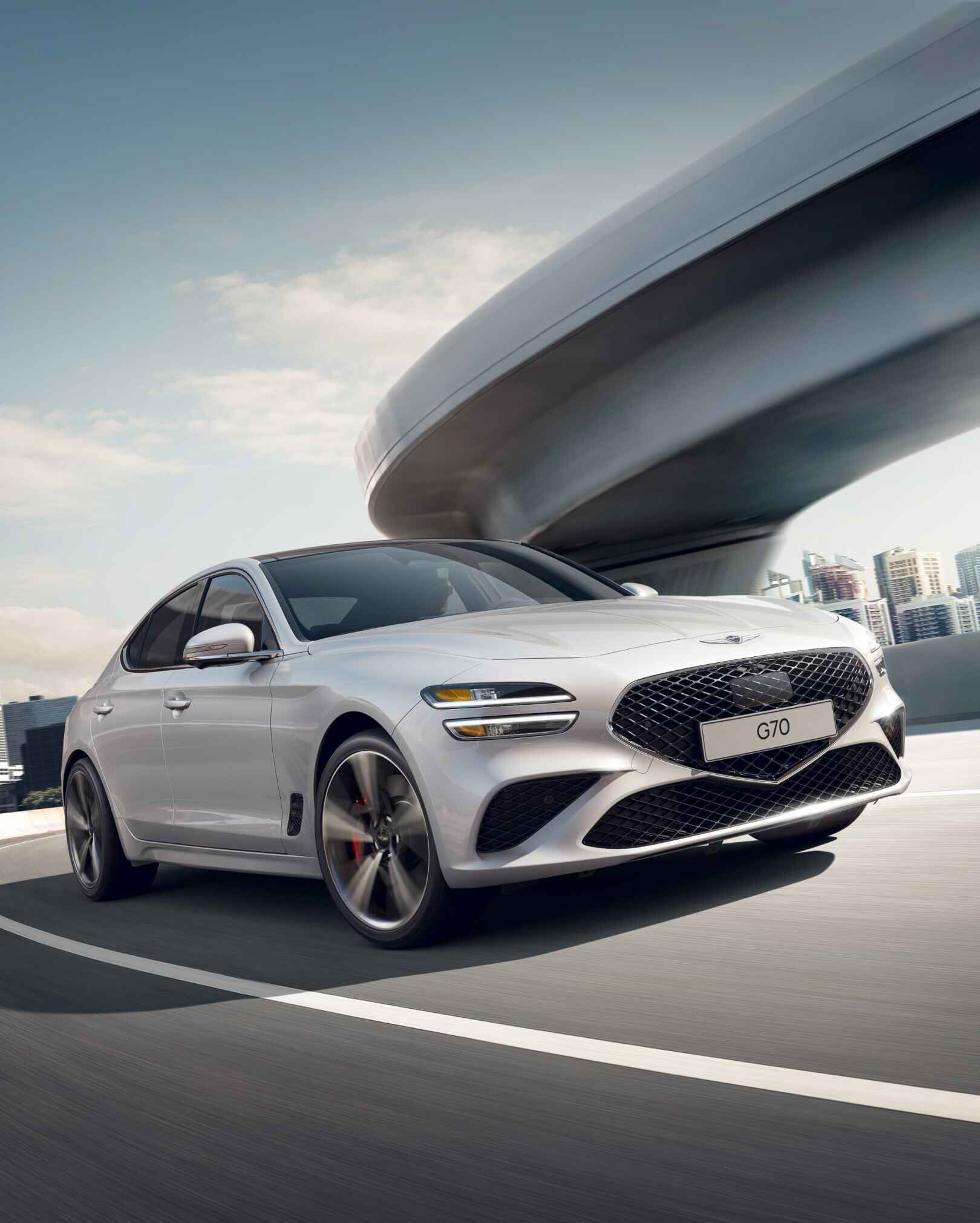 White G70, driving around a curve