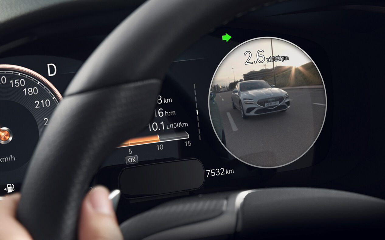 Close-up of G70 instrument cluster displaying video of rear side view