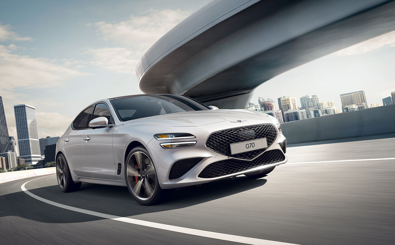 White G70, driving around a curve
