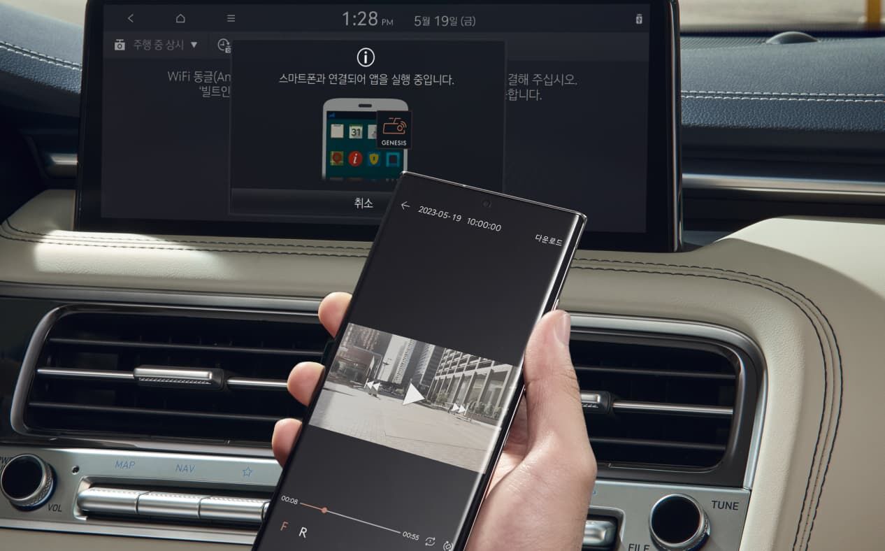 Person holding their phone up to view the built-in cam 