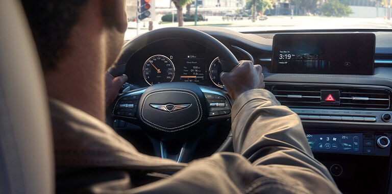 Man driving Genesis vehicle