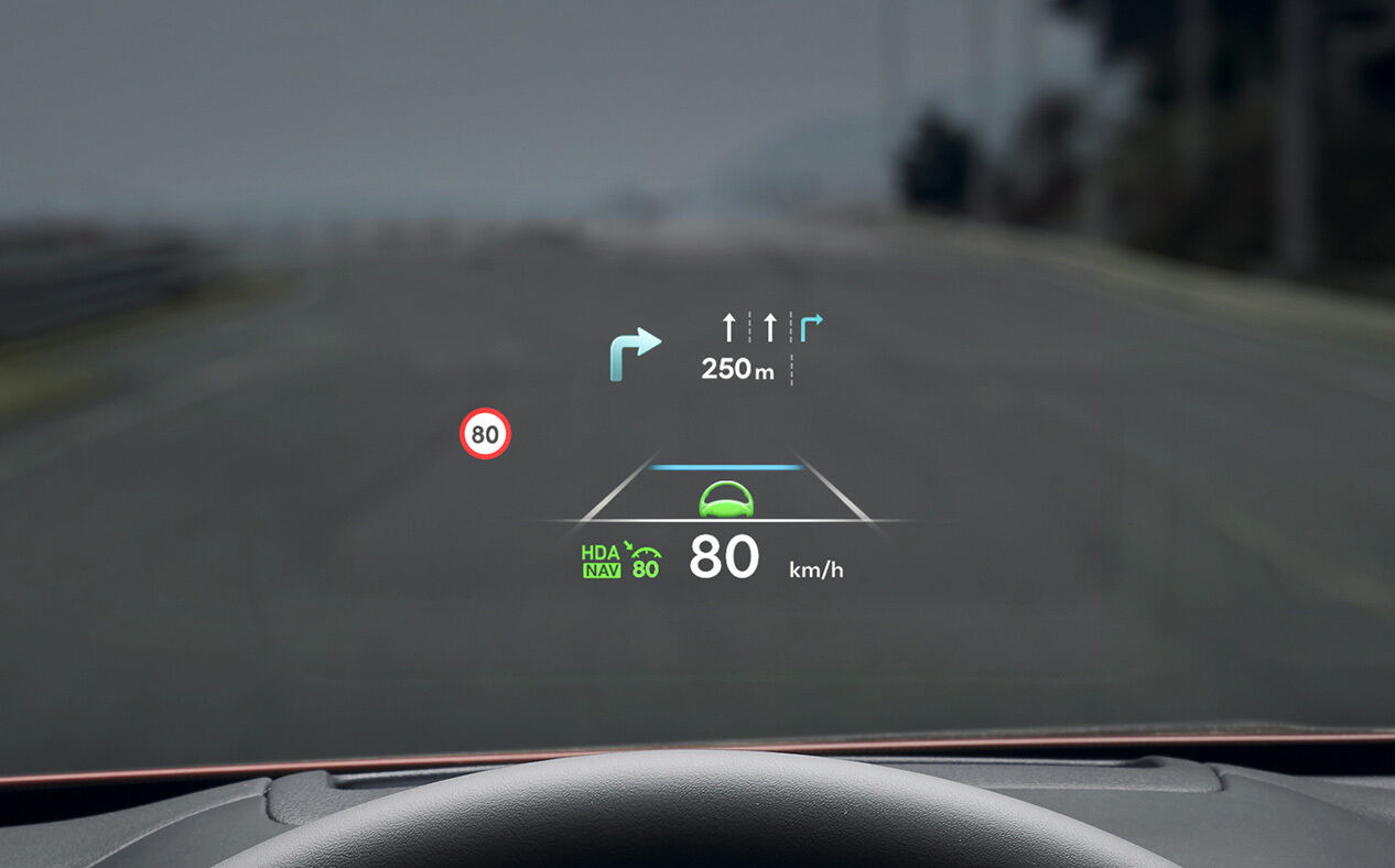 Navigation information is seen on the windshield. 
