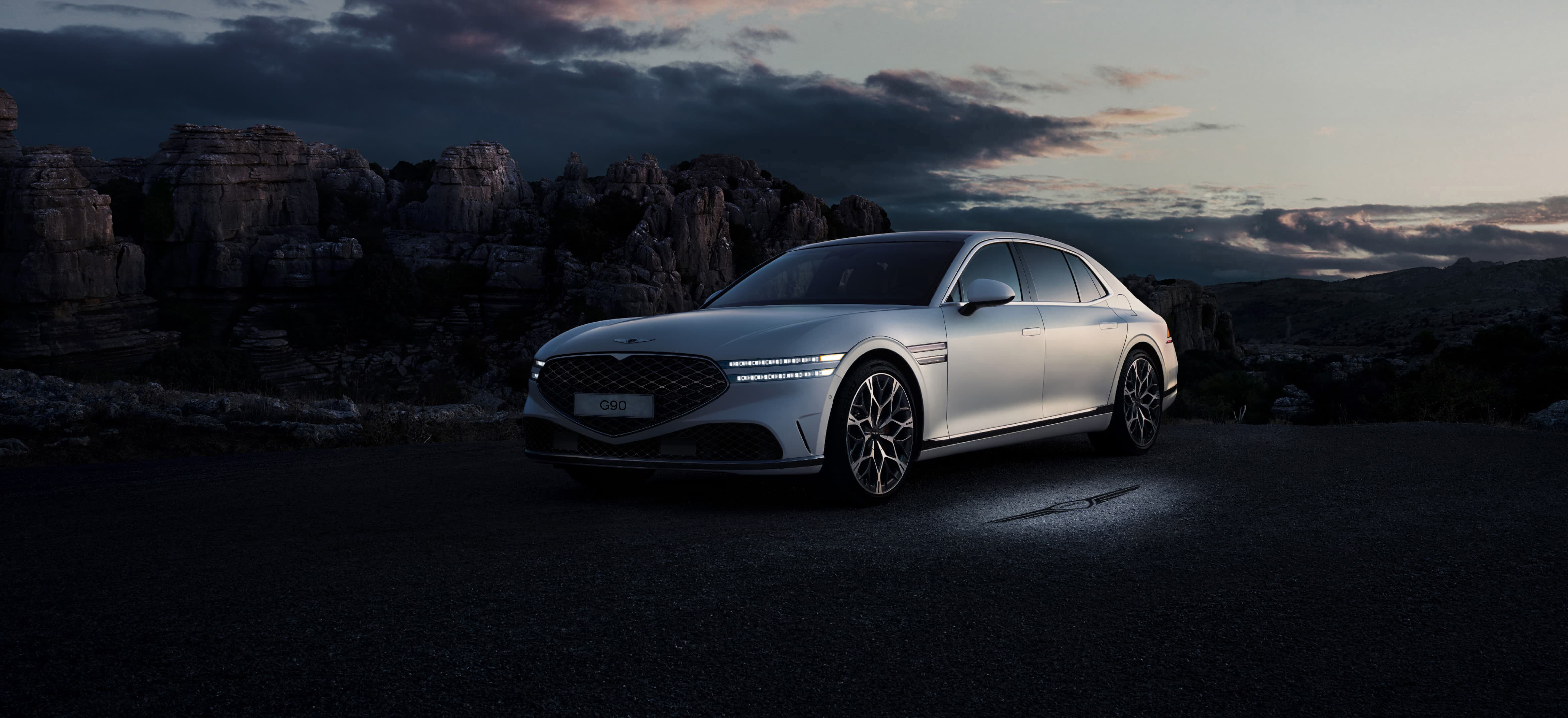 Front end of Verbier White G90 seen overlooking a cliff.