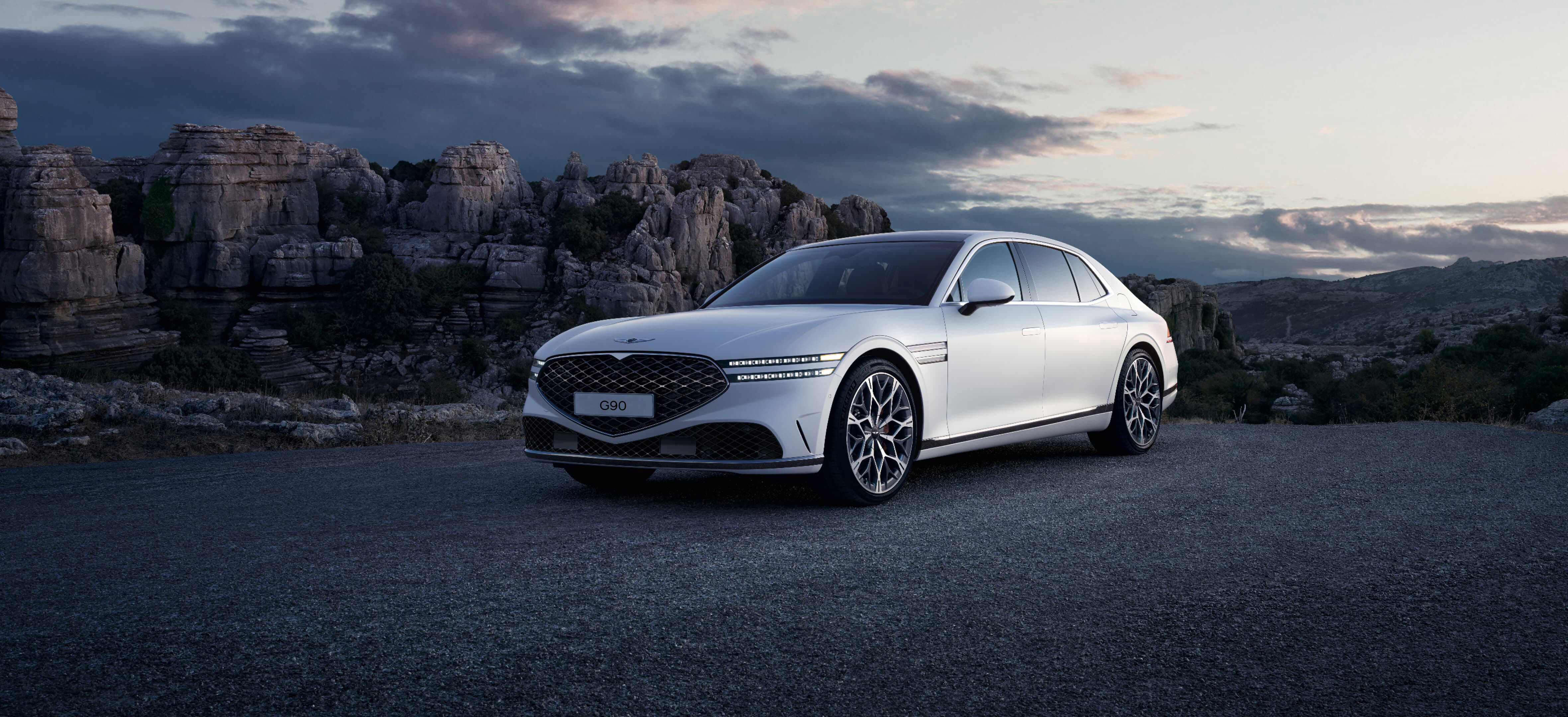 Front end of Verbier White G90 seen overlooking a cliff.