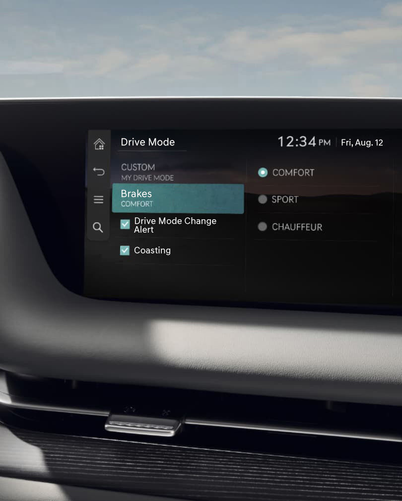 The brake mode screen is visible on the infotainment display. 