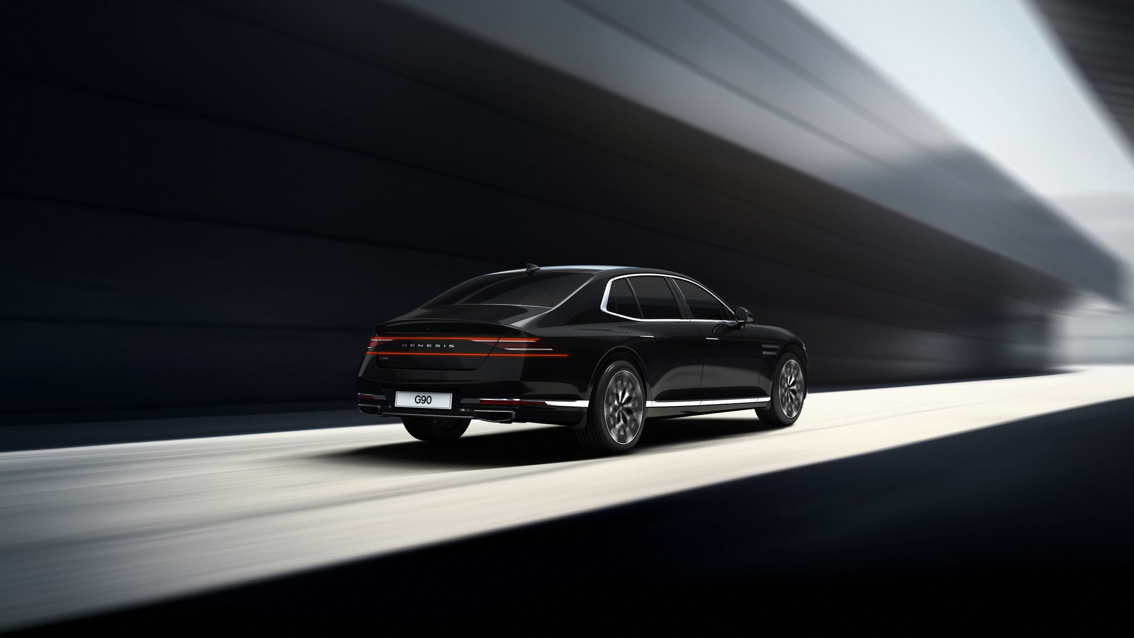 A G90 in Vik Black is driving.