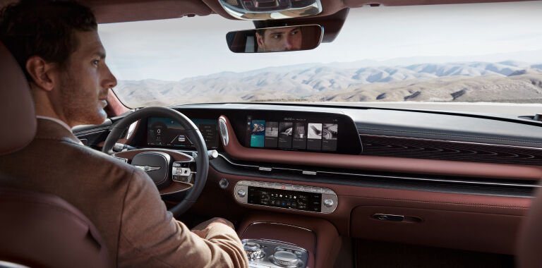 Man driving Genesis vehicle