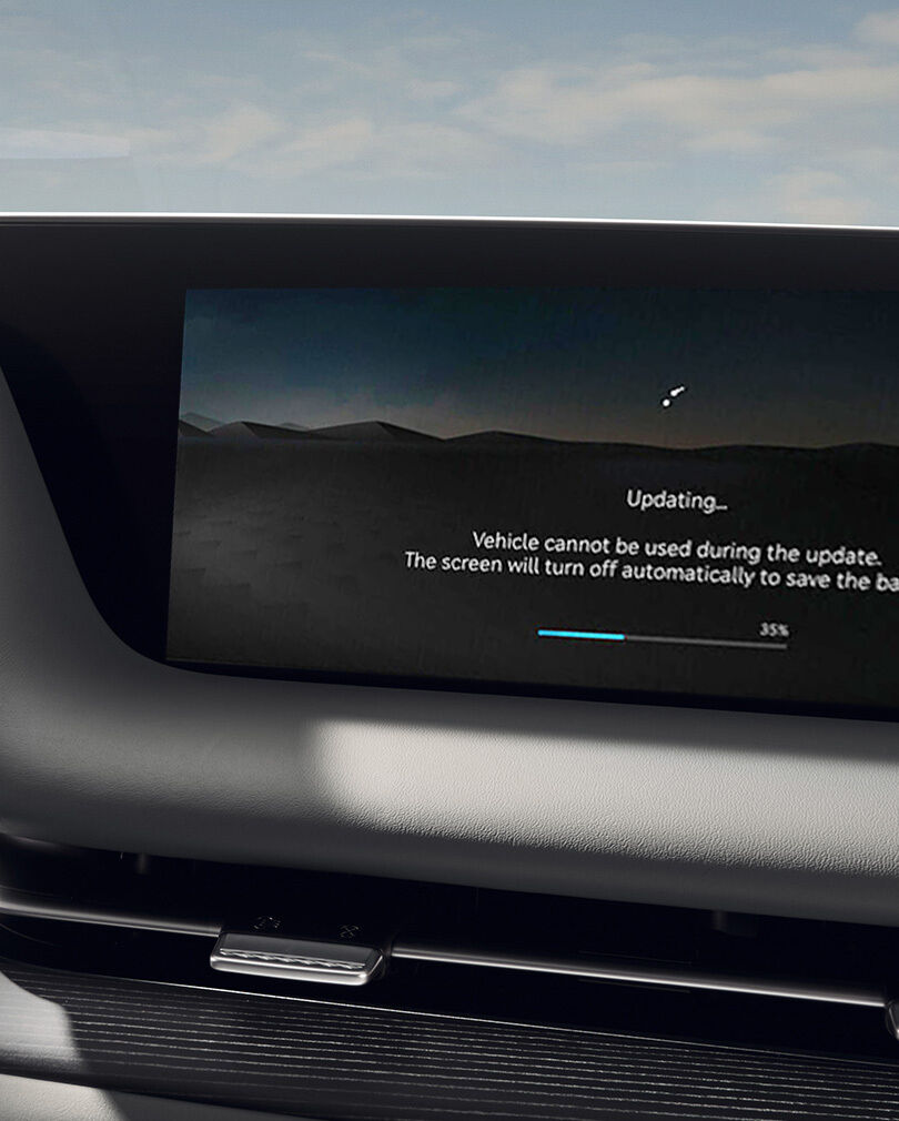 The Genesis gas station screen is visible on the infotainment display inside G90 interior.