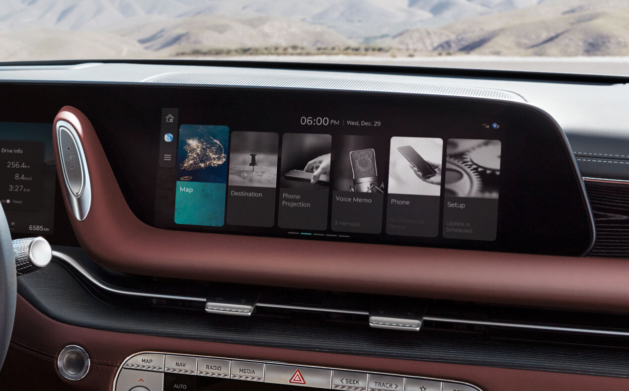 The infotainment display is seen with Bordeaux Brown seats. 