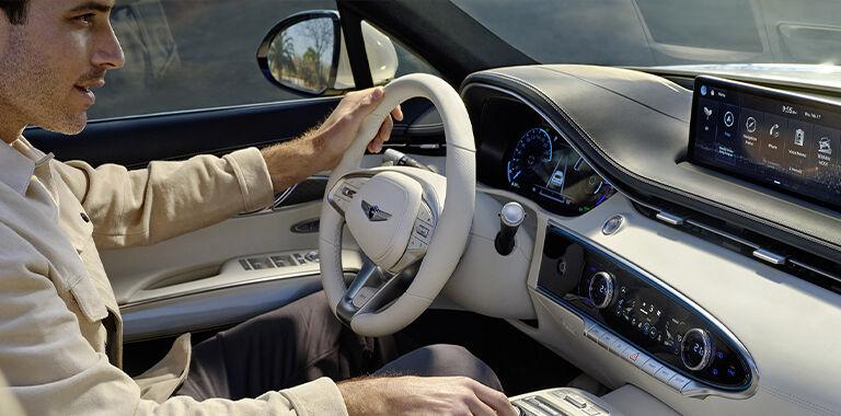 Man driving Genesis vehicle