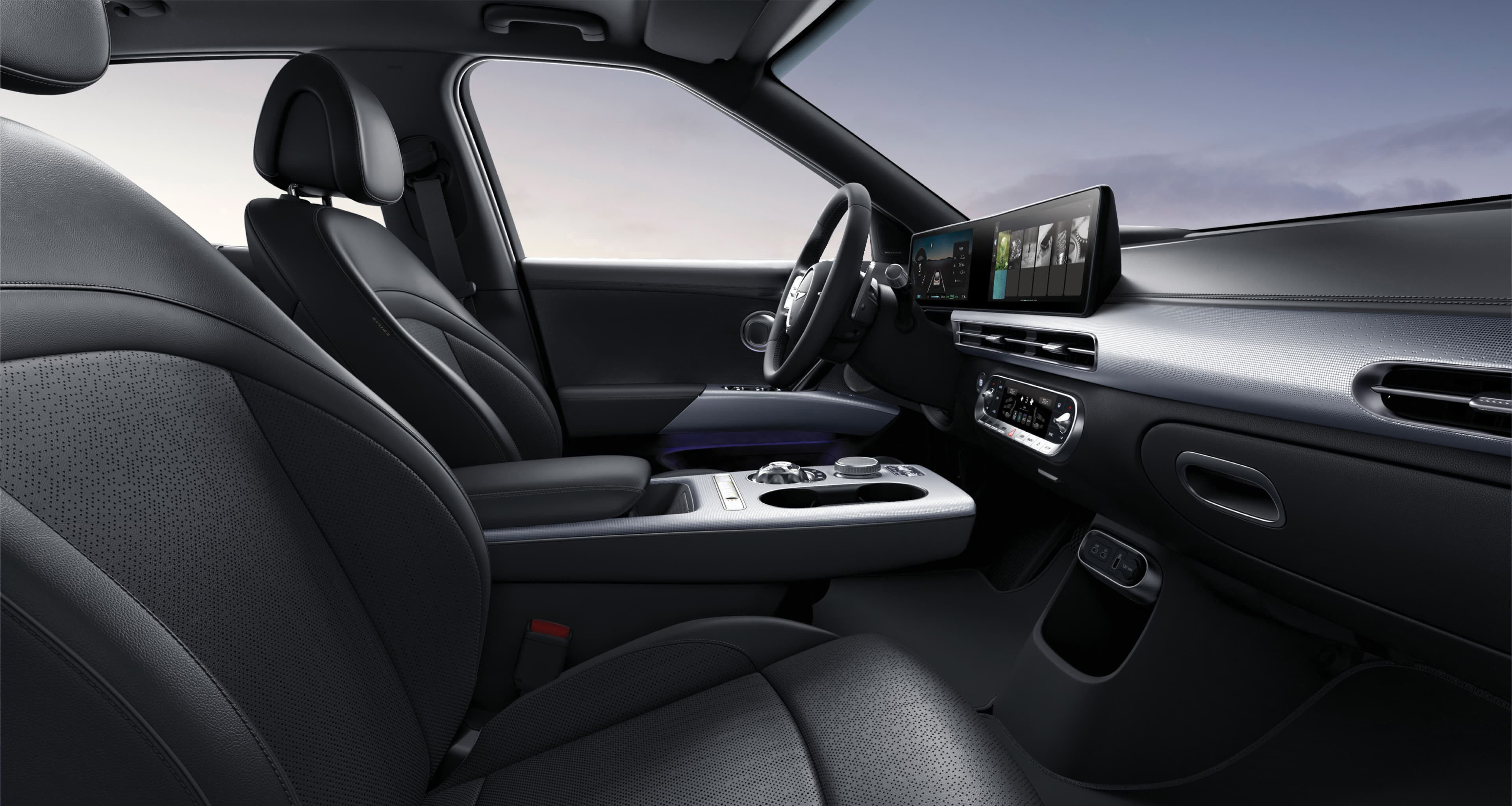 Looking at the driver's seat from the side of the passenger seat, GV60's interior in Obsidian Black Mono-tone.