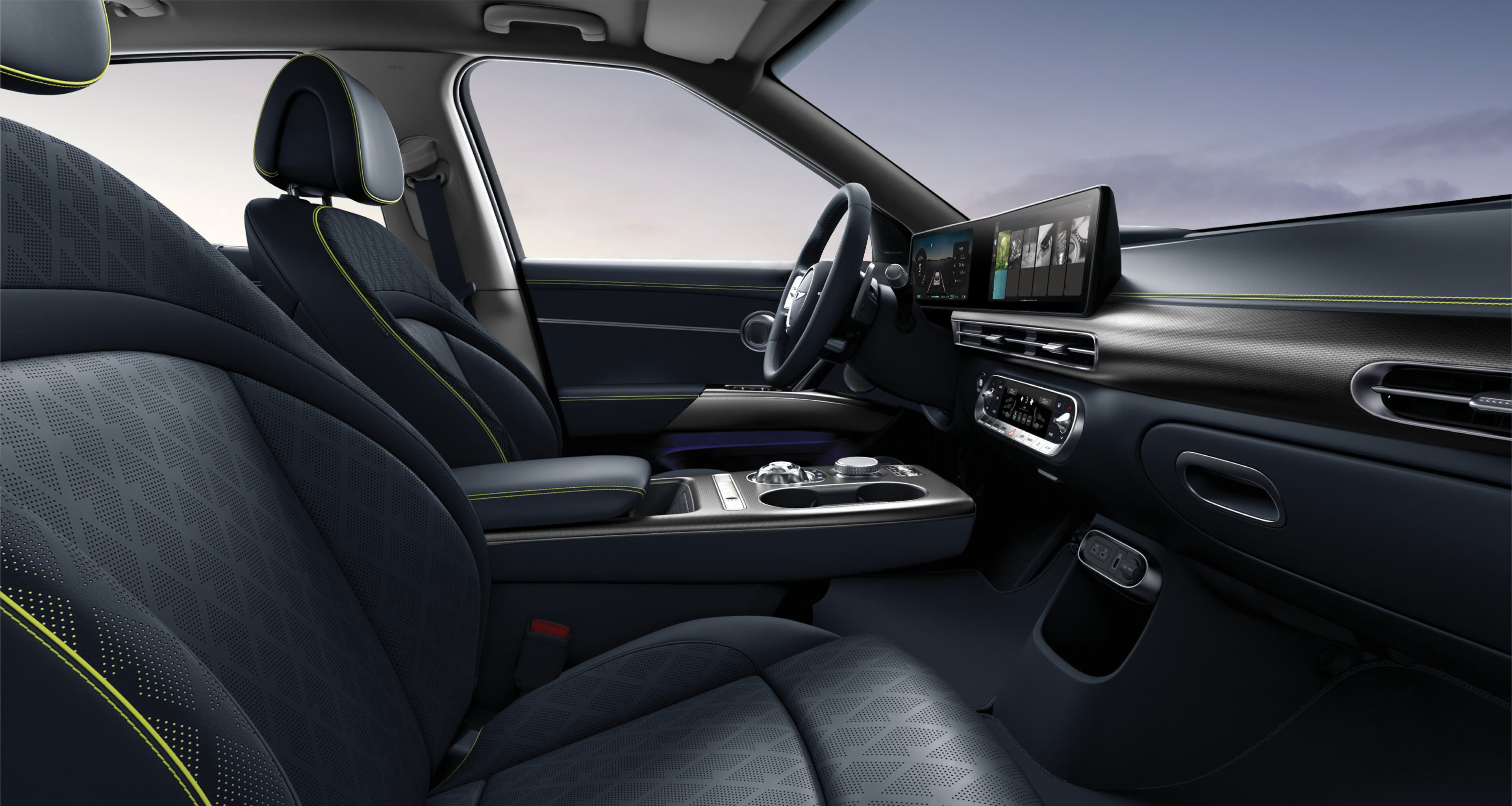 Looking at the driver's seat from the side of the passenger seat, GV60's interior in Torrent Navy Mono-tone.