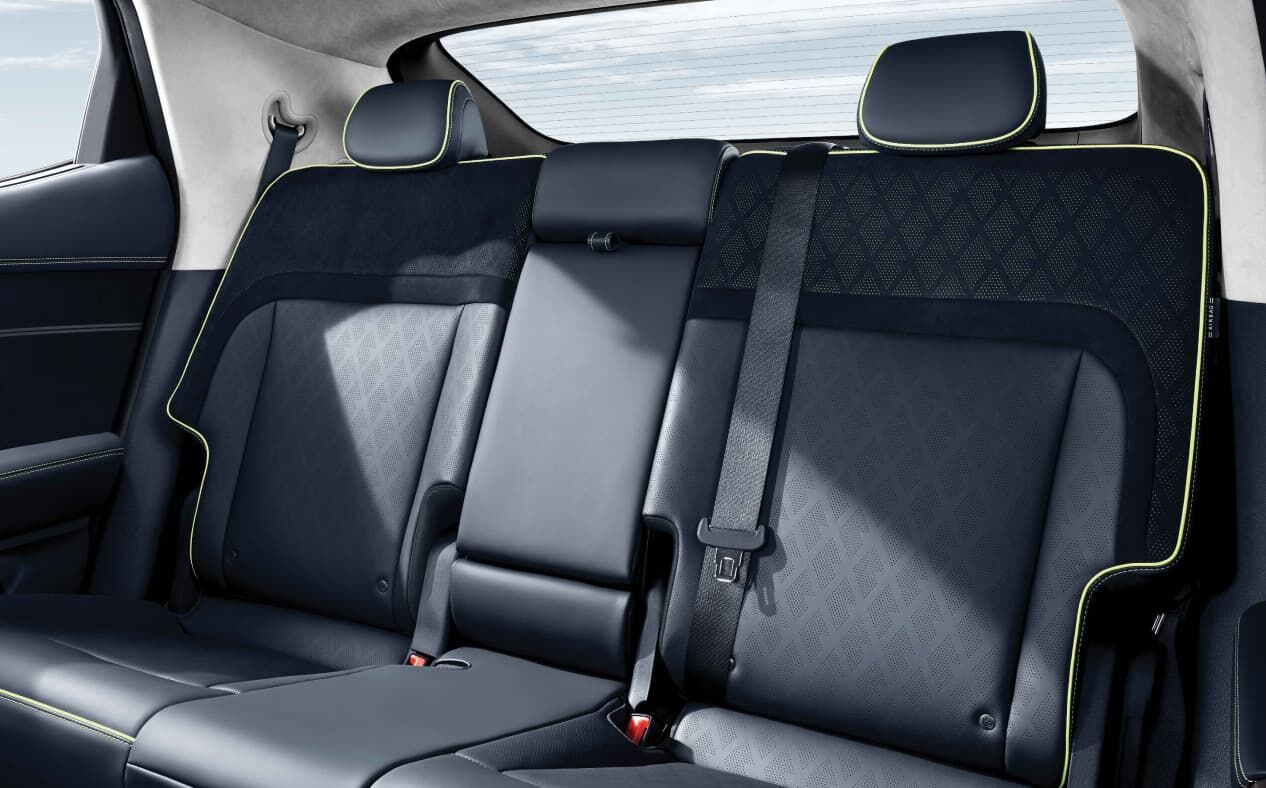 Rear seat row with the second-row cup holders raised.