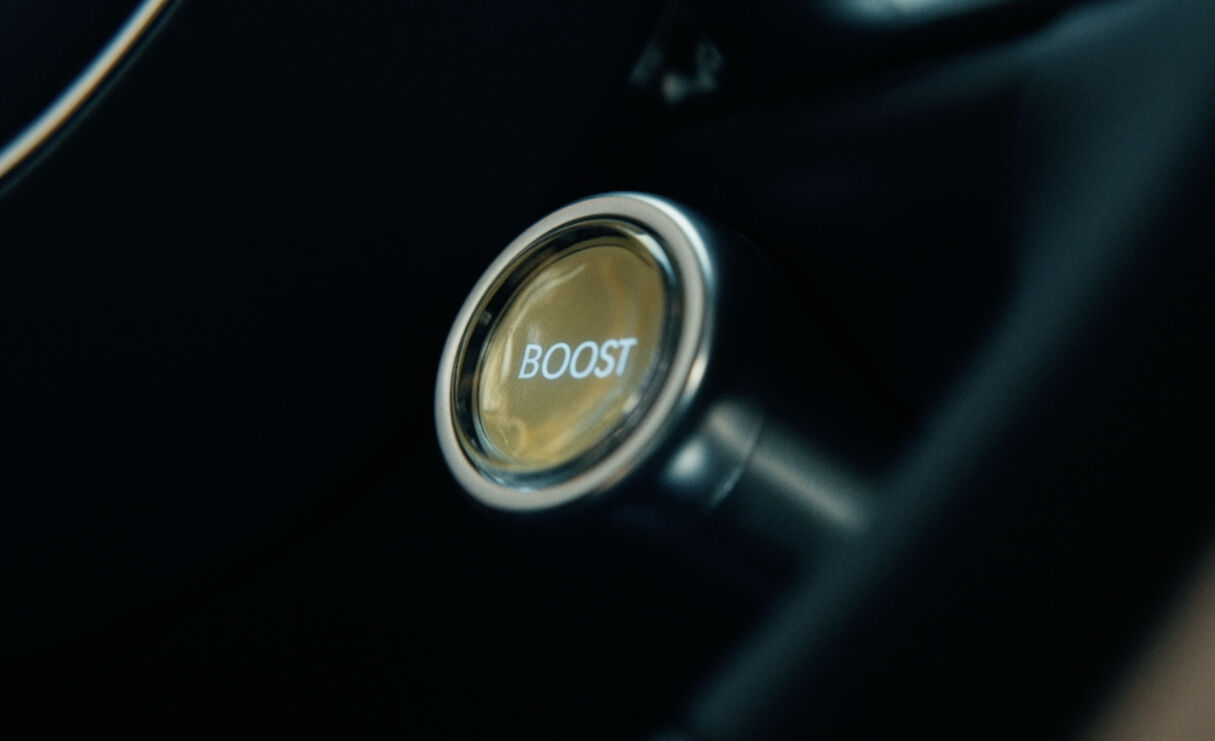 A close-up of the Boost Mode button.
