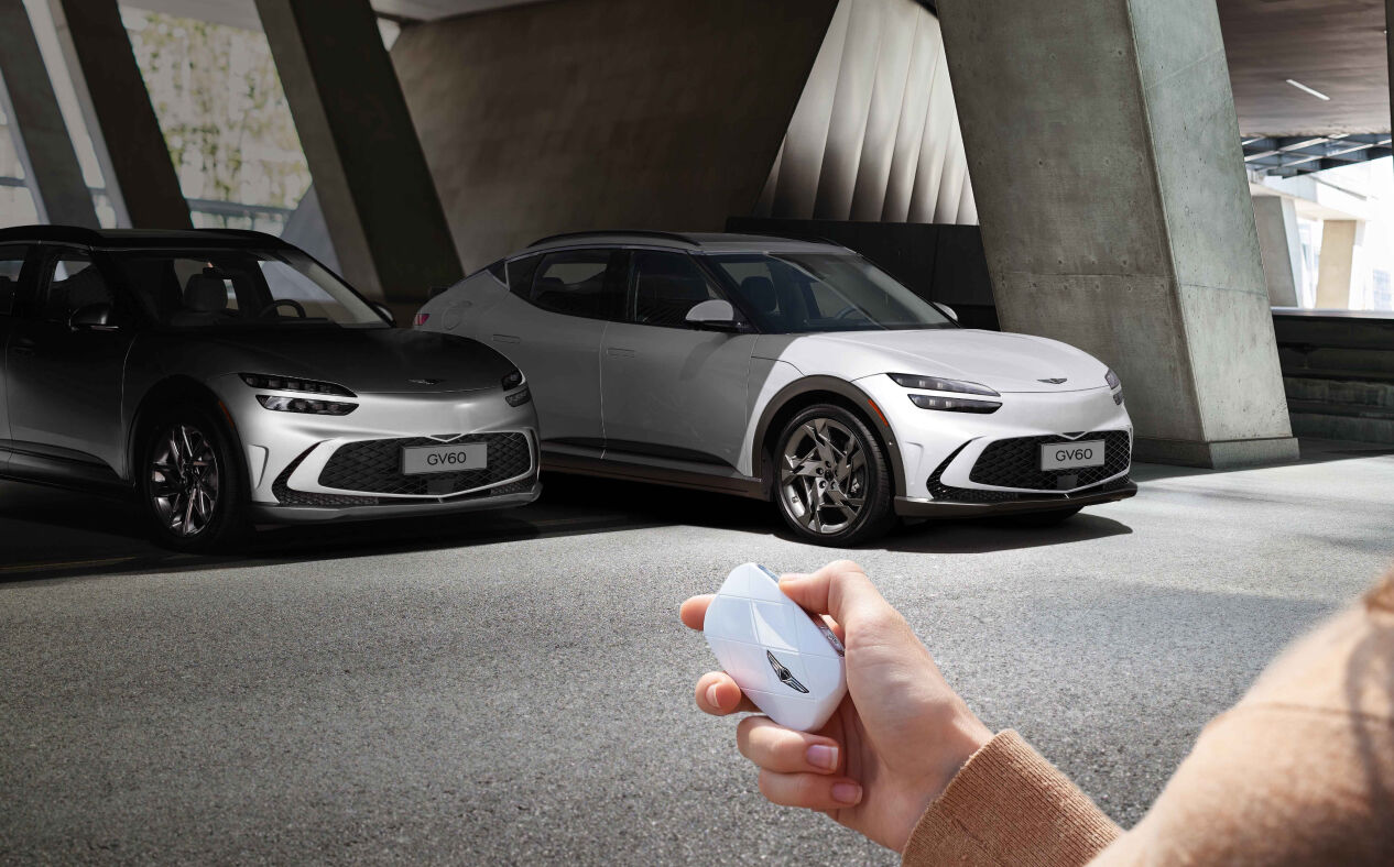 The car is being parked remotely using the smart key.
