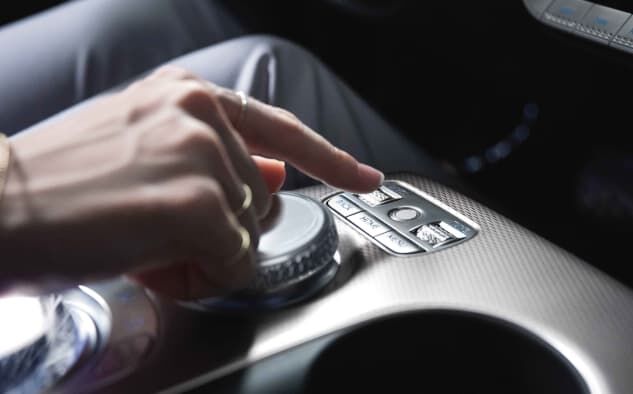 A driver can be seen placing their finger on the indoor fingerprint authentication system.