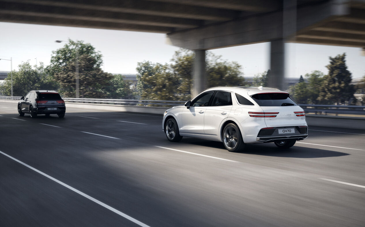 The GV70 is driving on the highway, adhering to its lane.