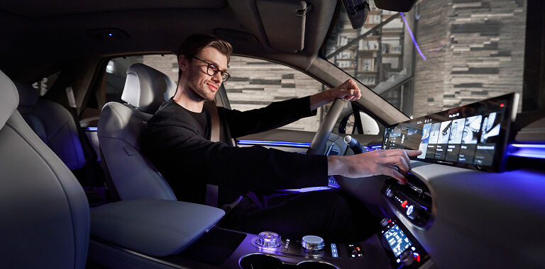 Man driving Genesis vehicle