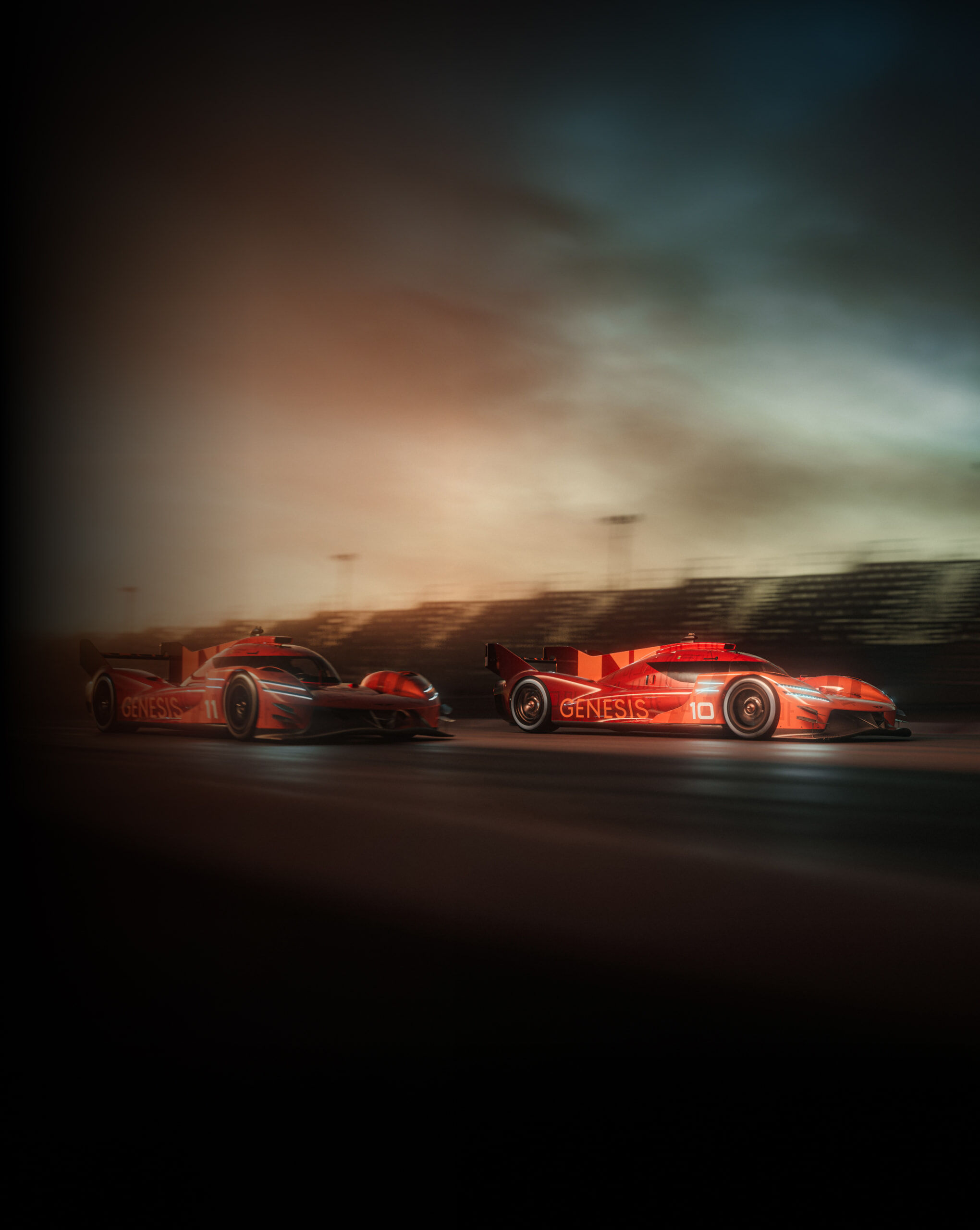 Two orange GMR-001 hypercars are racing on the racing track.