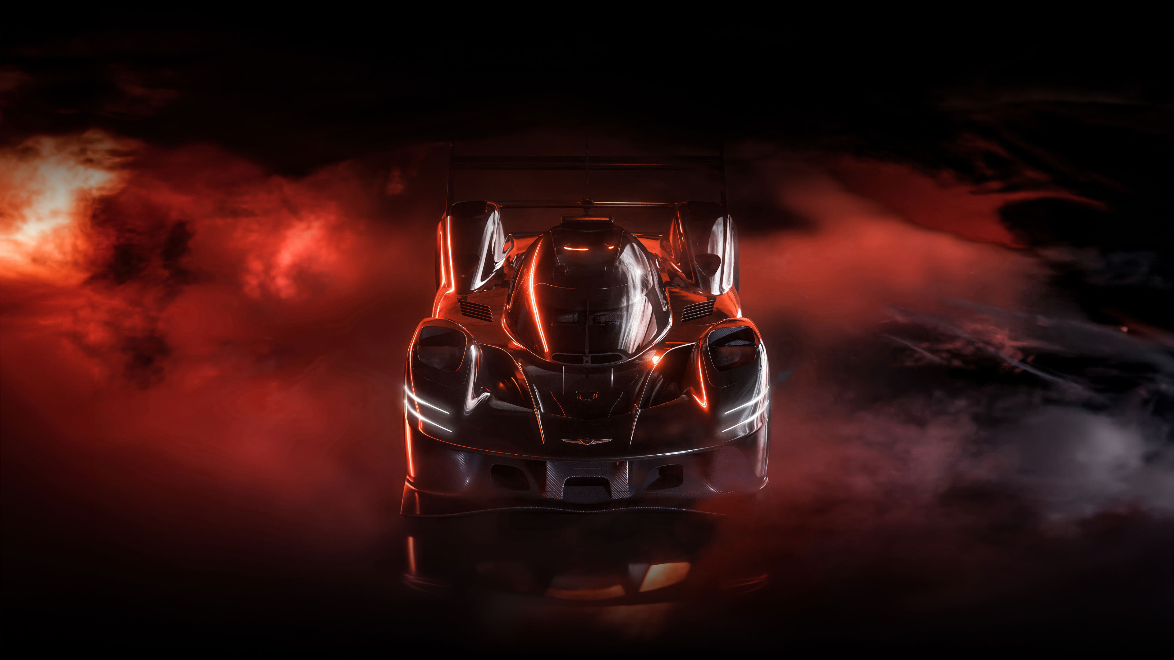 A top-down view of the black GMR-001 hypercar, with fog in the background.