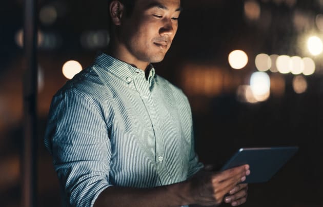 Man looking at a tablet