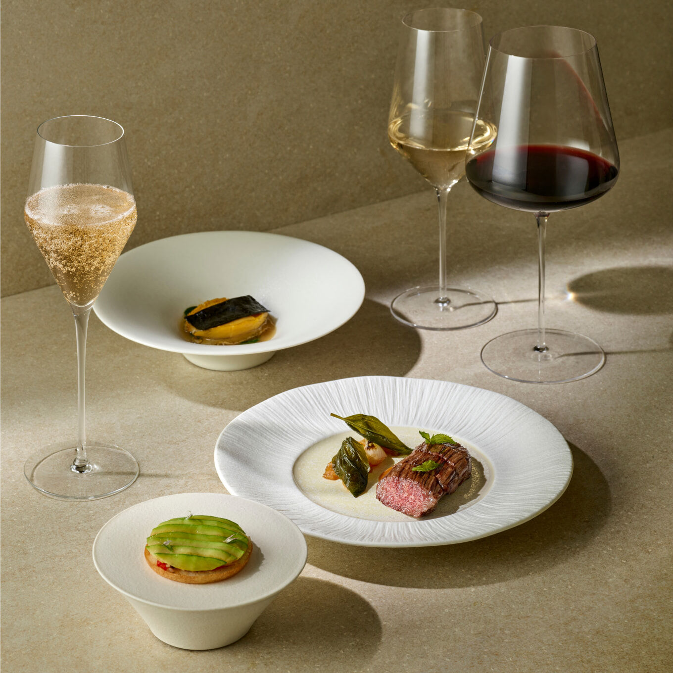 Champagne, white wine, red wine, and a tart with a steak green topping