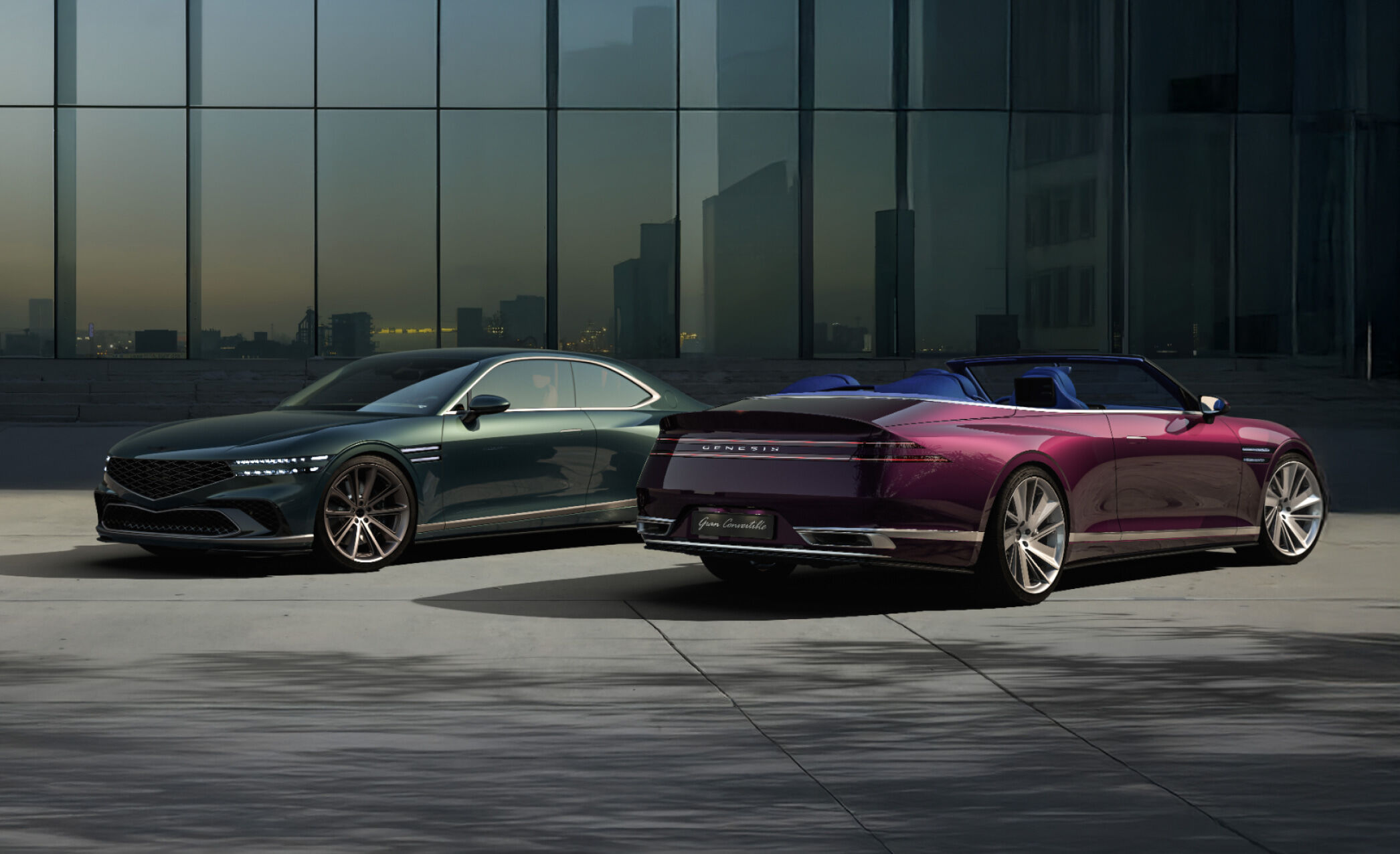 The Genesis X Gran Coupe and Convertible stand side by side in front of a modern city background. The convertible is showing the rear.