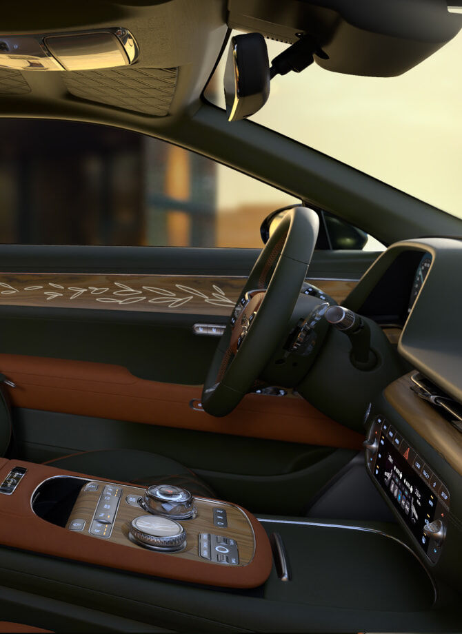 This is the interior driver's seat of the Genesis X Gran Coupe made of olive wood material. The steering wheel and controllers appear zoomed in.