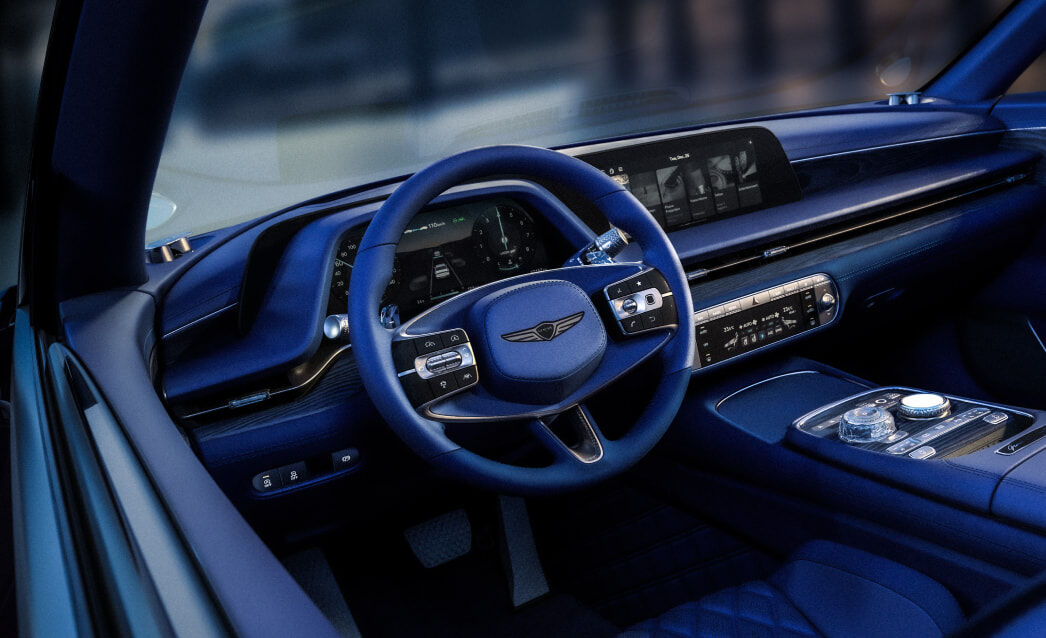 This is a view of the driver's seat from the window with the first row door open. You can see the blackberry colored car interior.