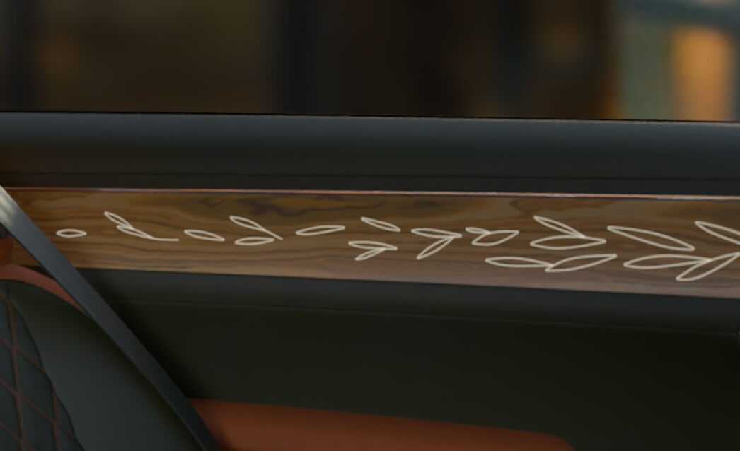 The side door panels appear zoomed in. Backlit graphics with an olive tree branch pattern stand out.