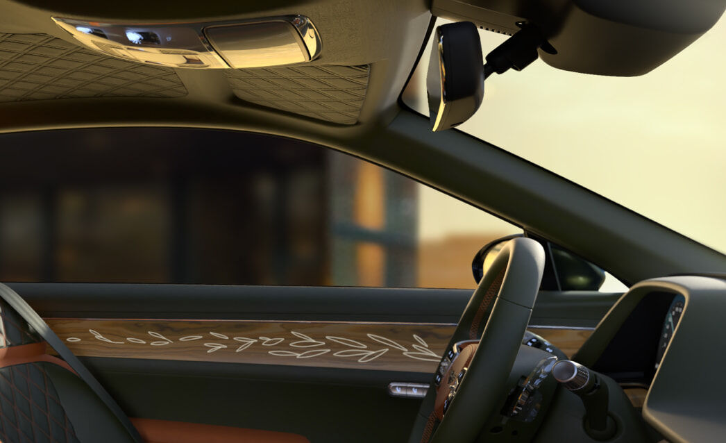 This is a view of the driver's seat from the passenger seat. The olive wood pattern on the side doors stands out.