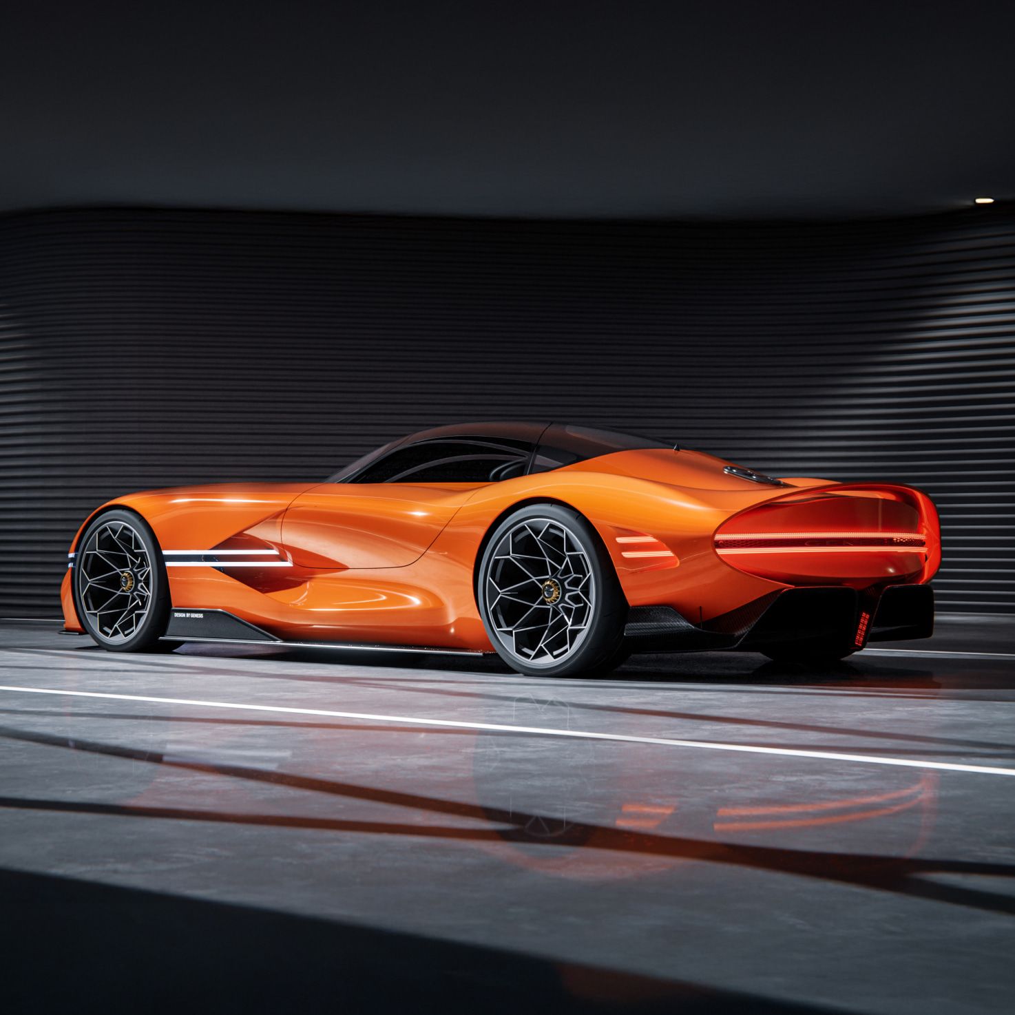 Side view of the X Gran Berlinetta Concept parked indoors with lights on