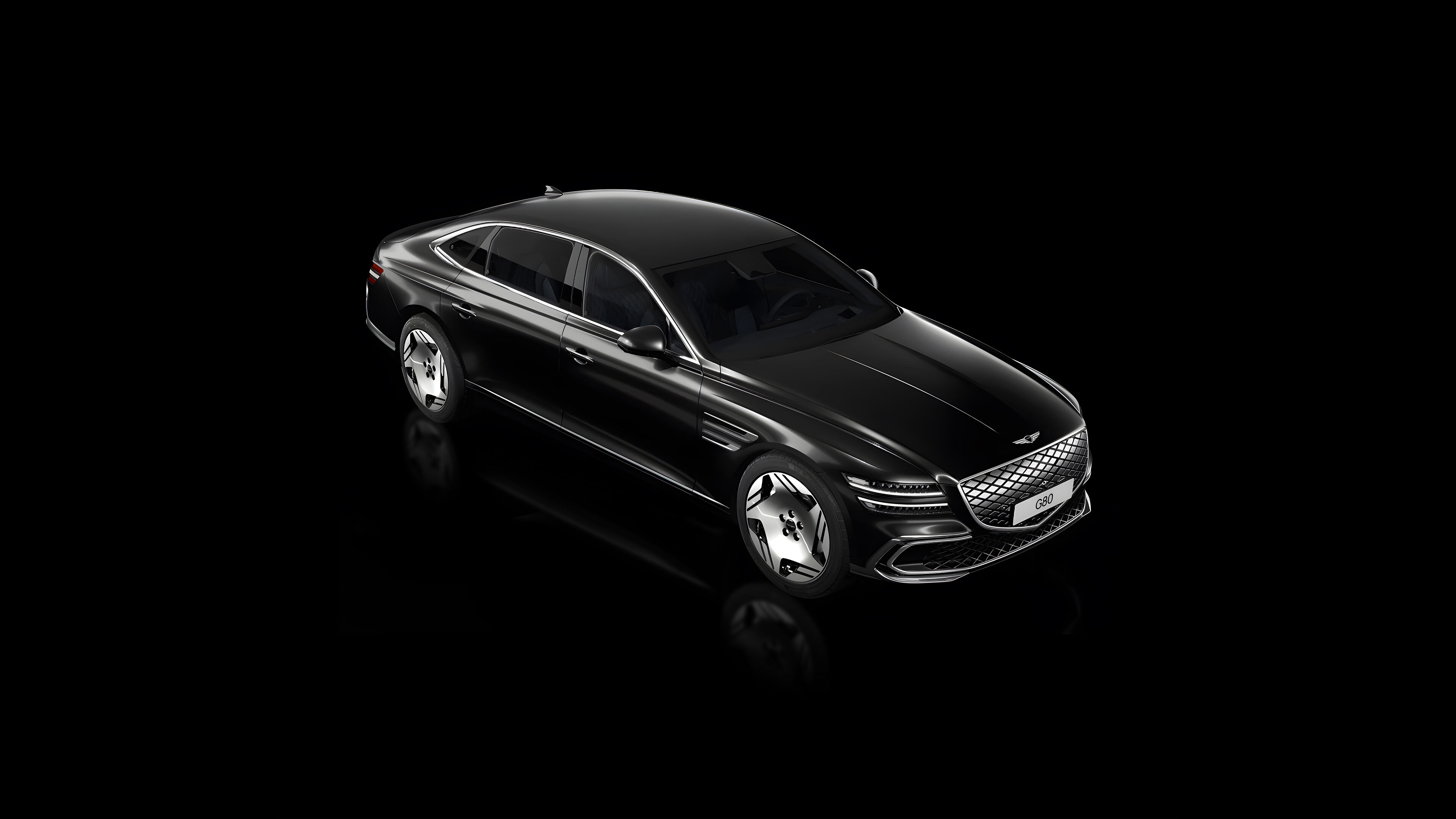 A view of the Electrified G80 in Vik Black, looking down from the top left. Scroll down to reveal the interior parts of the car with removal of the exterior.