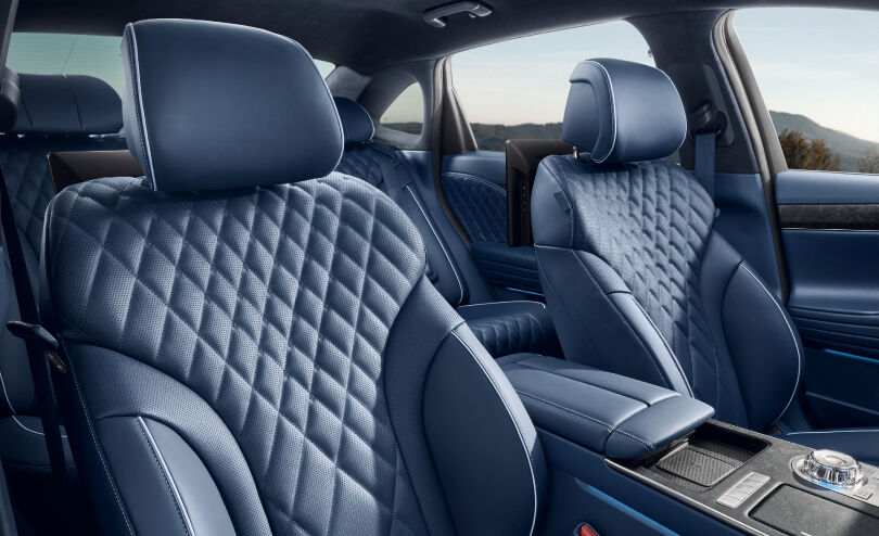 You see the front seats inside an Electrified G80 vehicle. The seats feature elaborate quilted leather.