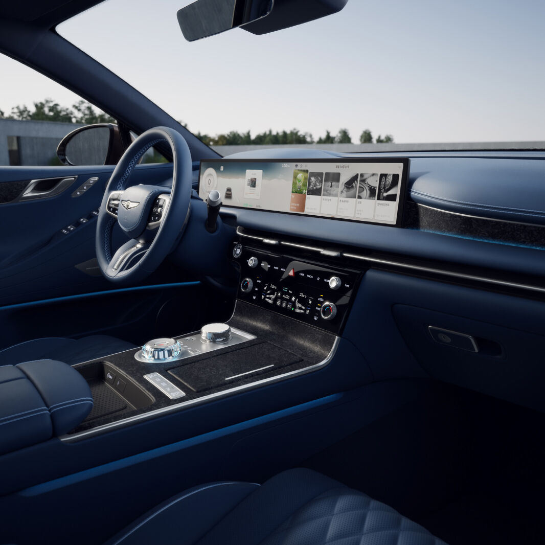 The center control panel next to the driver's seat is highlighted. Notice the mood lamps located above the shift dials.