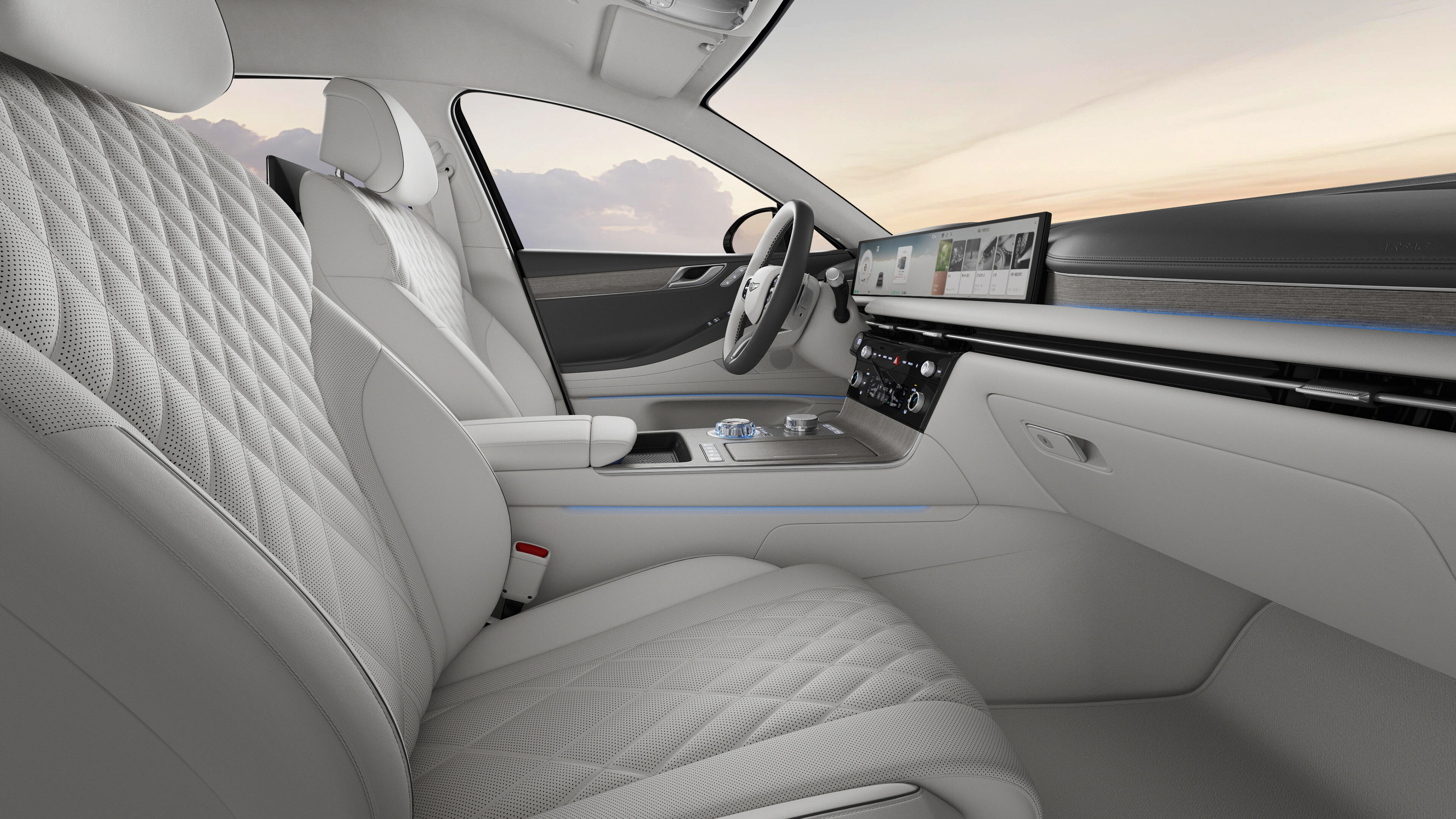 The interior of the Electrified G80 with its Glacier White color design and Ash Gray garnish is shown.