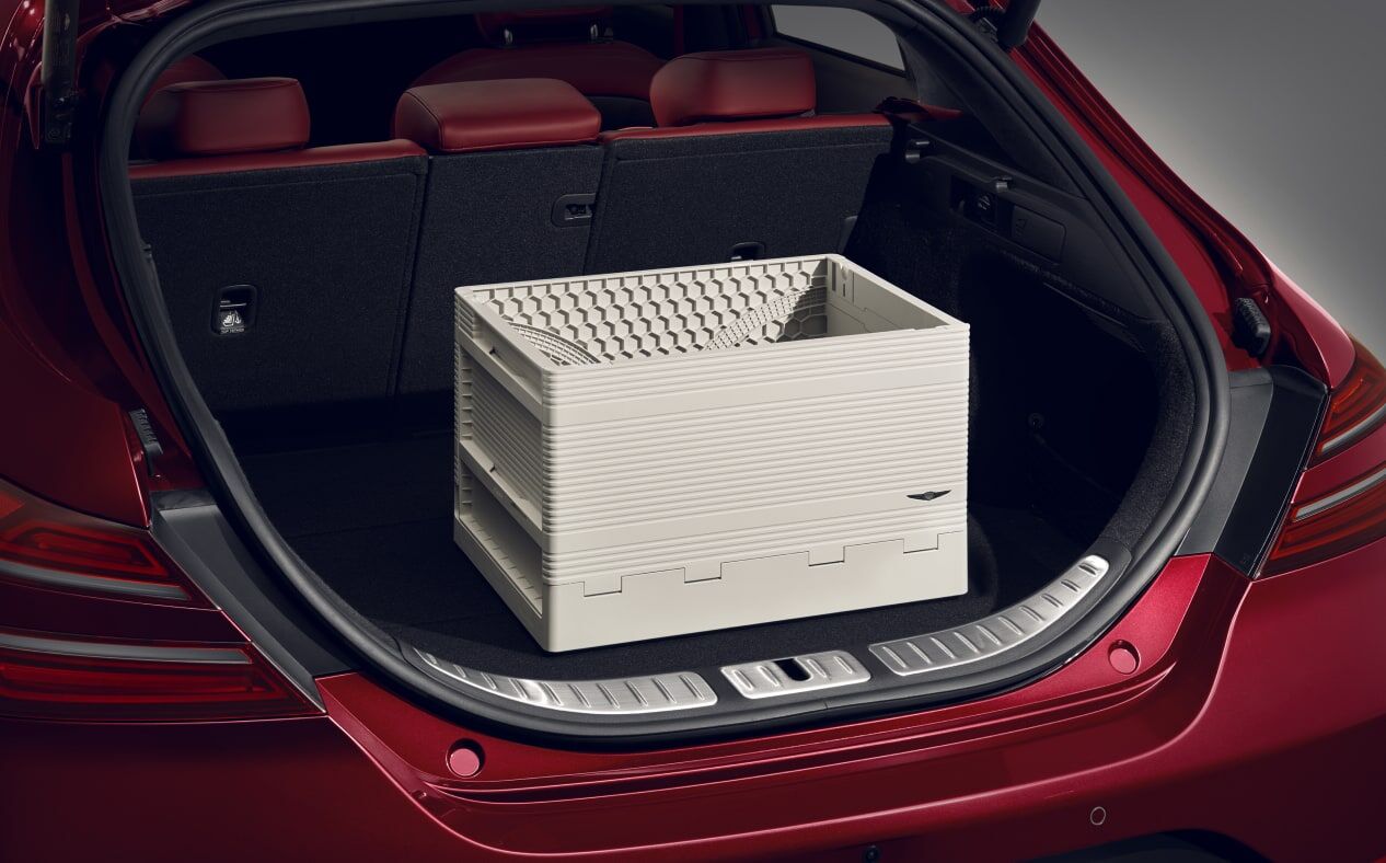 The foldable cargo box can be seen in the trunk of the Cavendish Red G70.