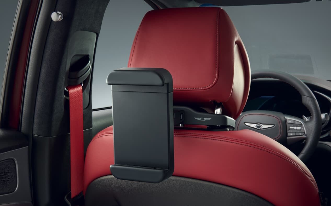 Tablet holder is attached to the back of the driver's seat.