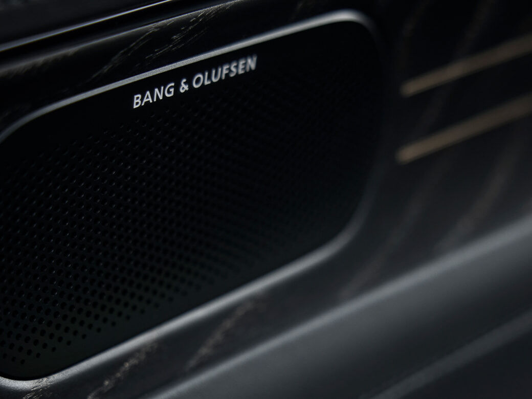 A close-up view of the Bang & Olufsen speaker.