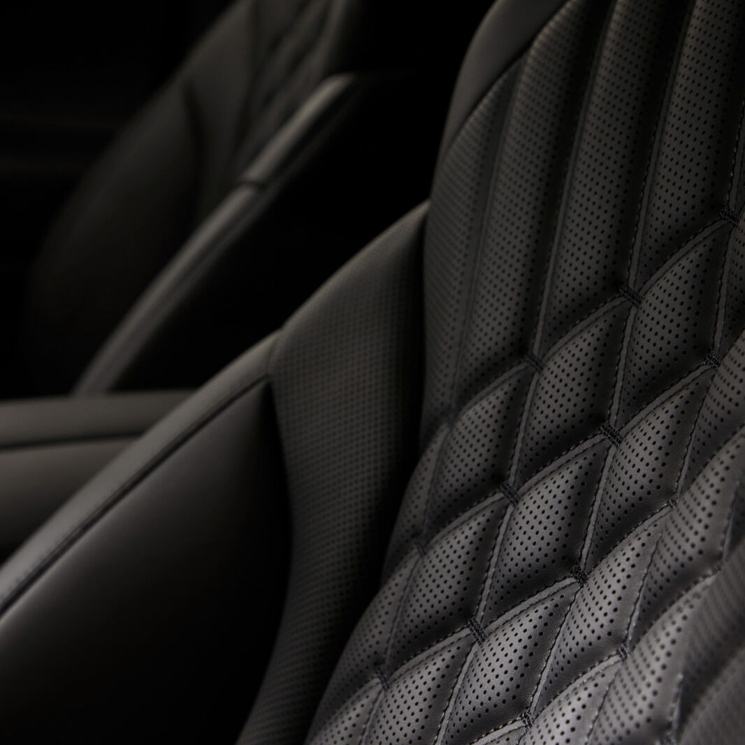 The black diamond-shaped seat quilting pattern is emphasized.