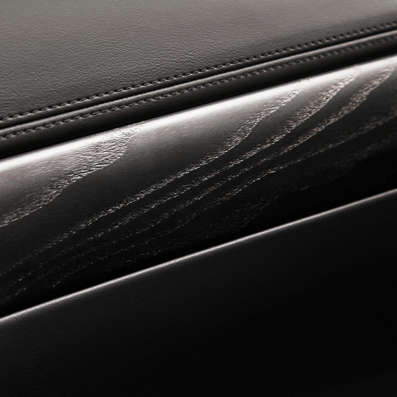 The rich texture of the black ash real wood interior trim is highlighted.