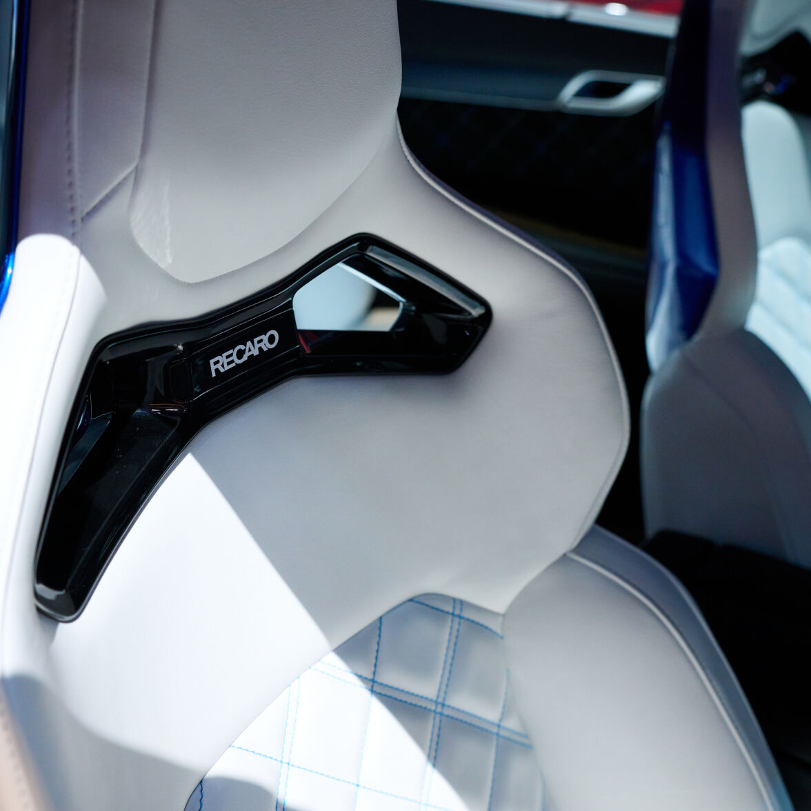 Vision blue two-tone Genesis Electrified G80 Magma Concept's interior can be seen, with interiors featuring white and blue two-tone colors.