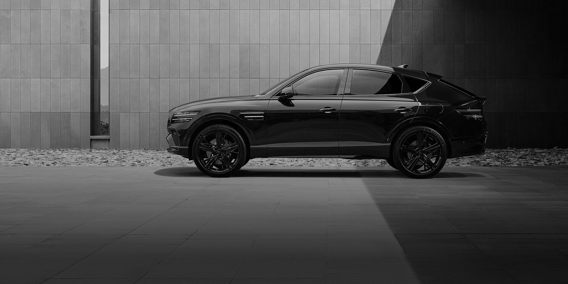 This is the front side view of the Genesis GV80 Coupe Black vehicle.